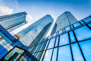 Perspective view of glass skyscrapers with blue skies